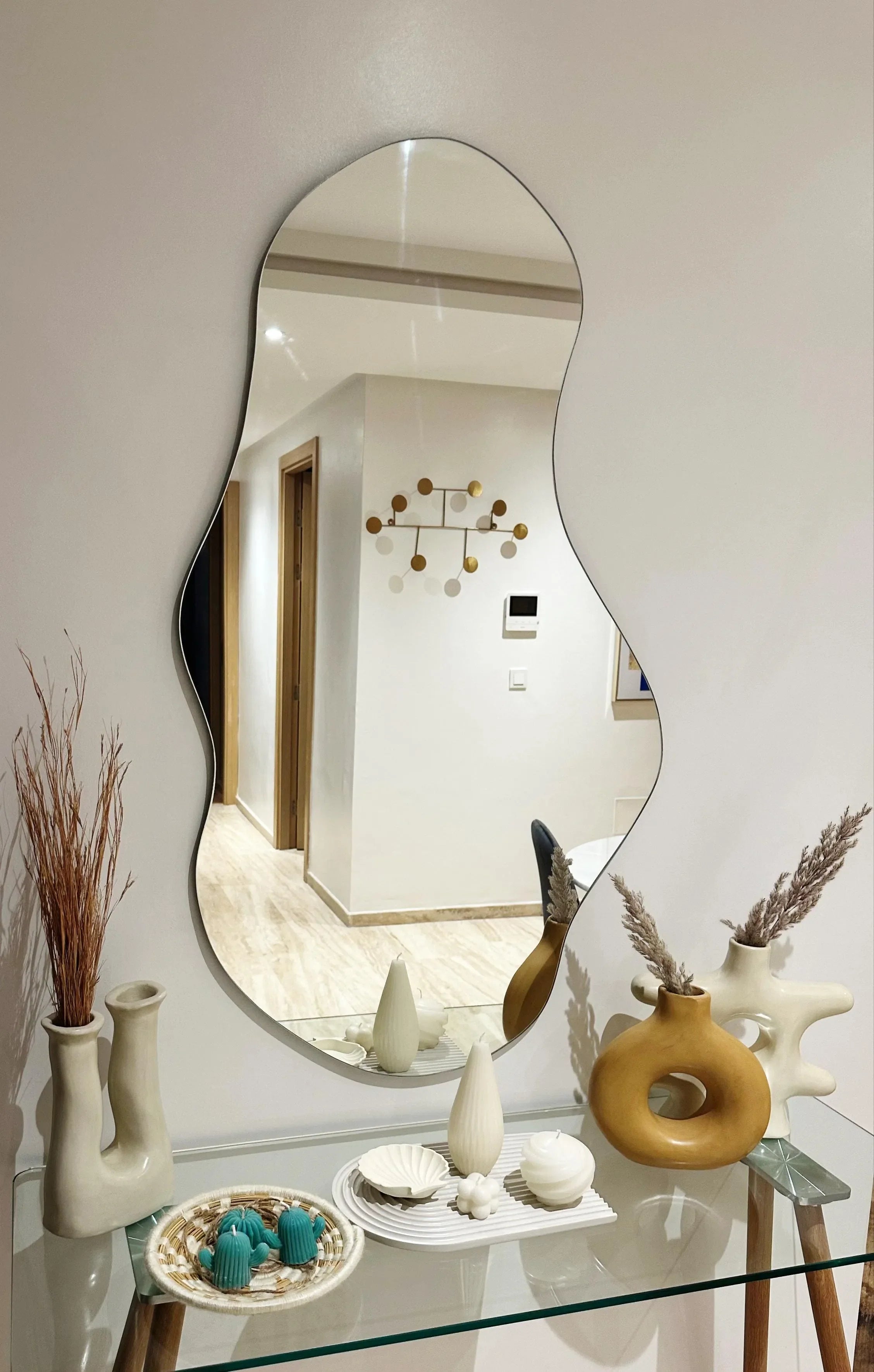 Miroir mural moderne 100x60 cm – design fluide et artistique.